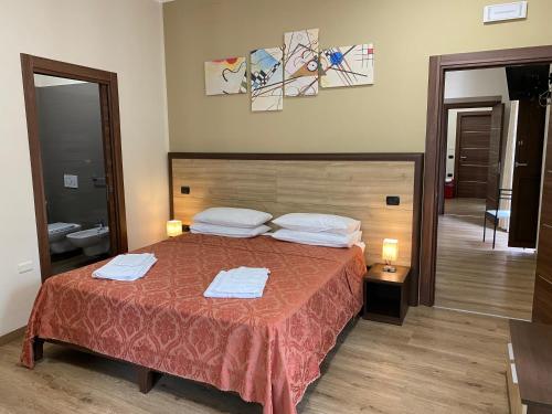 Postel nebo postele na pokoji v ubytování B&B Duomo Apartament