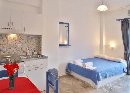 Postel nebo postele na pokoji v ubytování Helios Studios & Apartments