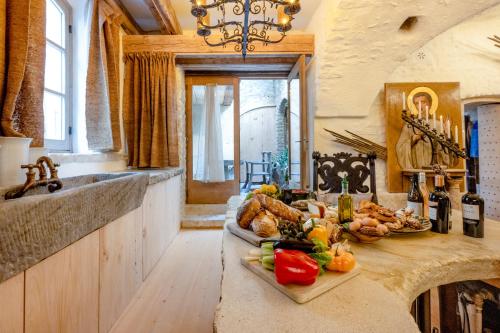 a kitchen with a counter with food on it at L'unique in Goult