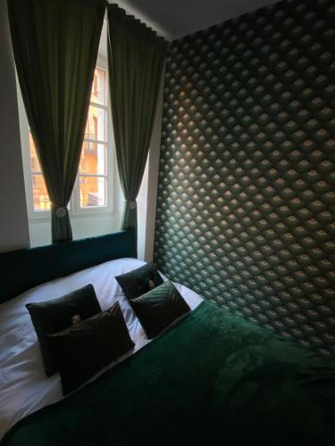 a bedroom with a bed with pillows and a window at Le Rivage - Centre historique et Bord de lac in Annecy