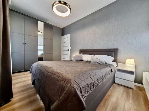 a bedroom with a large bed in a room at EASY RENT Apartments- Business Center 205, Free Parking, 24h Check-in in Lublin
