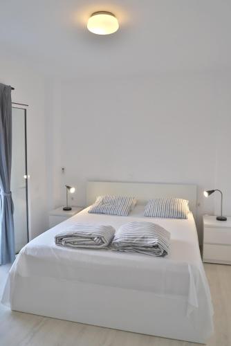 Postel nebo postele na pokoji v ubytování Helios Studios & Apartments