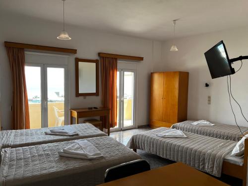 Postel nebo postele na pokoji v ubytování Tsoutsouros Apts