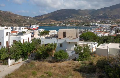 a view of a town with a river and buildings at Ruby's summer house with spacious garden and free parking in Gavrion