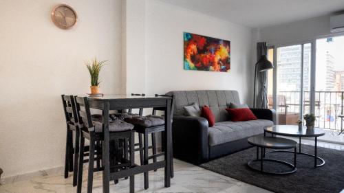 a living room with a couch and a table at Apartamento costa del sol in Torremolinos