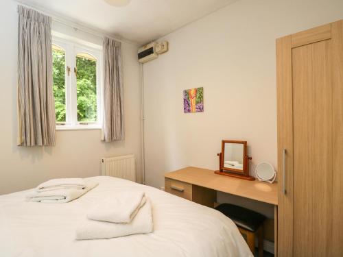 Ένα ή περισσότερα κρεβάτια σε δωμάτιο στο Garden Cottage