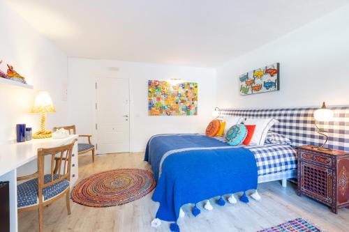 Ένα ή περισσότερα κρεβάτια σε δωμάτιο στο CasaBlu - An Andalusian Boutique Hotel