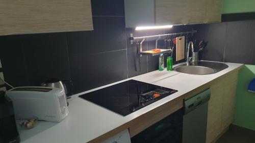 Kuchyň nebo kuchyňský kout v ubytování Paris Montmartre, Mairie du 18e