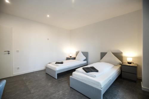 Postel nebo postele na pokoji v ubytování W&G Hotel