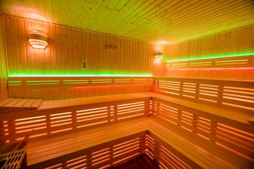 a empty room with green and green lights at Hotel Zum Goldenen Löwen in Peitz