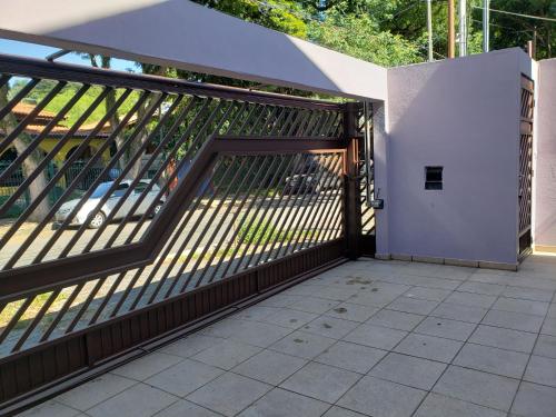an open gate on a building with a patio at Pousada Monte Gerizim in Sao Paulo
