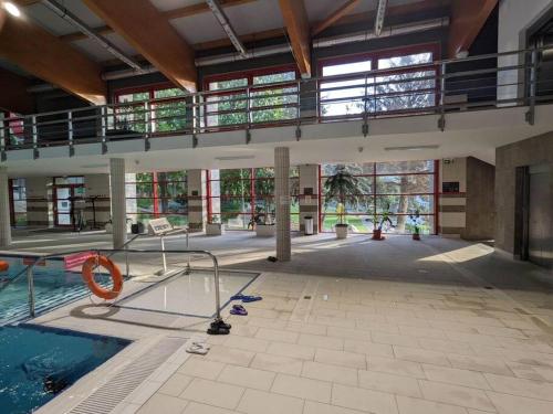 a large building with a swimming pool and a large building at Apartment close to Sziget festival in Budapest