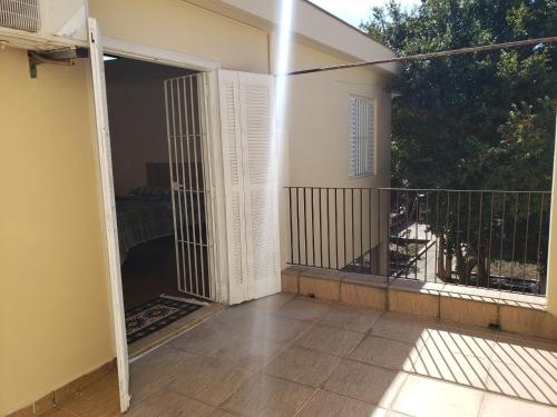 an open door to a balcony in a house at Pousada Monte Gerizim in Sao Paulo