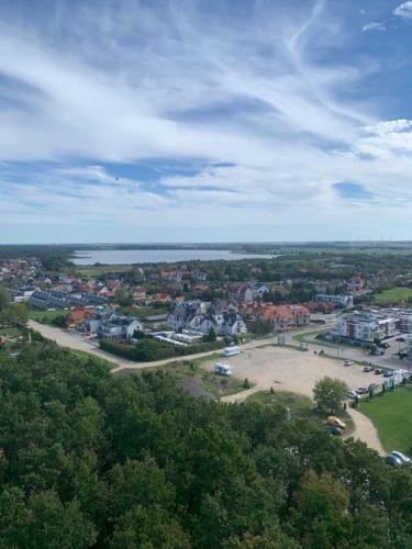 an aerial view of a town with a body of water at Albatrosa 17 - apartament nr 3 in Rewal