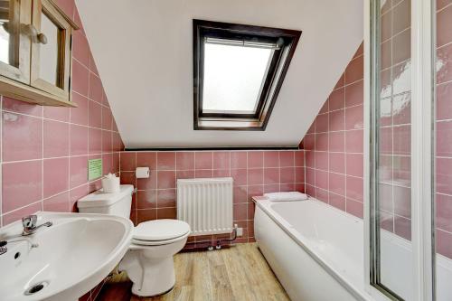 a bathroom with a sink toilet and a bath tub at Dunkery Cottage Wheddon Cross in Minehead