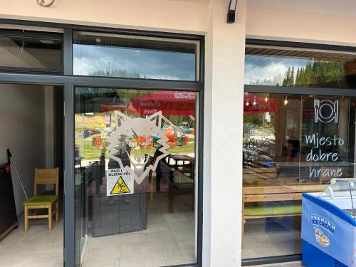 a store front with a sign in the window at Aparthotel Jahorinski Konaci in Jahorina