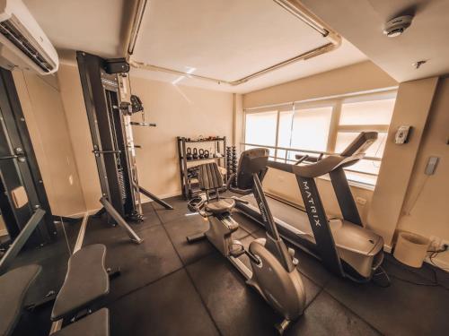 a gym with cardio equipment in a room at Sol Ipanema Hotel in Rio de Janeiro