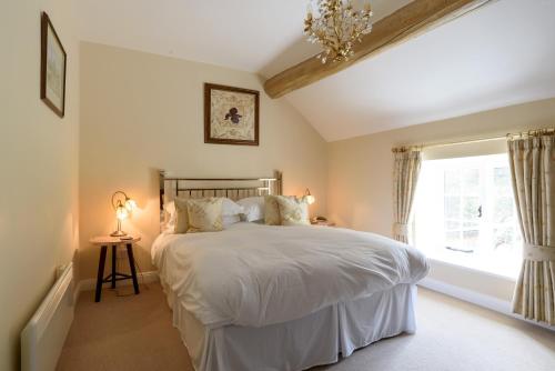 En eller flere senge i et værelse på Brackendale Cottage Upperdale Peak District