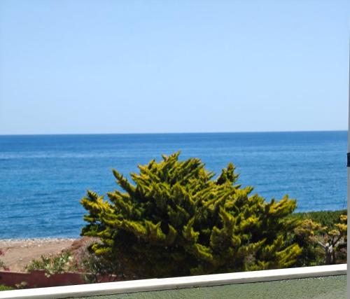 a view of the ocean from a balcony at Locanda in Monemvasia