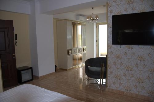 TV a/nebo společenská místnost v ubytování Alessio Hotel Residence