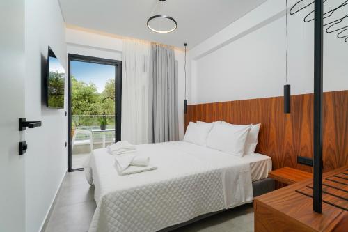Postel nebo postele na pokoji v ubytování Nuevo Suites