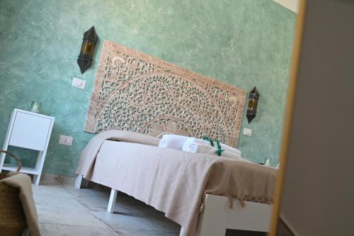 Ένα ή περισσότερα κρεβάτια σε δωμάτιο στο Riad Casa Vacanze