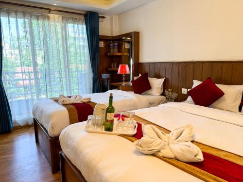 Postel nebo postele na pokoji v ubytování Hotel Abi International