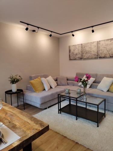 a living room with a couch and a table at Ferienwohnung Katharina in Mastershausen