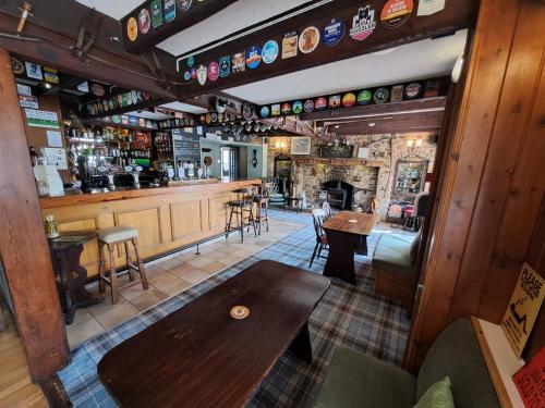 an overhead view of a bar with a wooden table at The Countryman’s Inn in Hunton