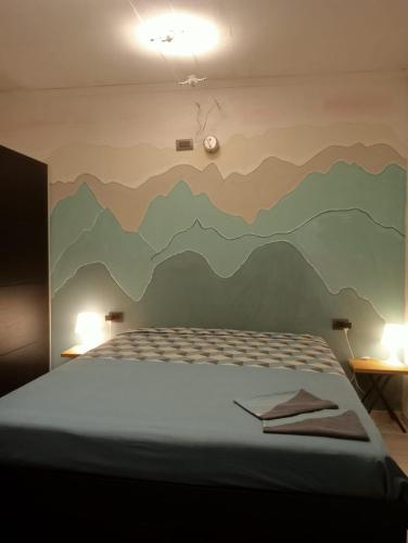 A bed or beds in a room at Rosa Bianca