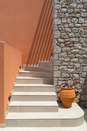 a set of stairs with a flower pot on them at Rhodes Island View in Ixia