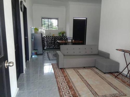 a living room with a couch and a table at One Lot - Lodging Two in Arau