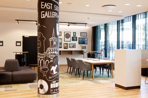 a conference room with a table and chairs at Holiday Inn Berlin City East Side by IHG in Berlin