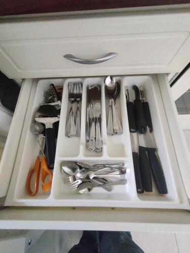 a drawer filled with utensils in a refrigerator at RöhköStar 109 in Äkäslompolo