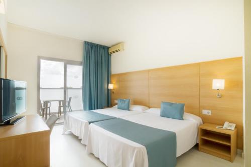 Postel nebo postele na pokoji v ubytování Ibersol Playa Dorada