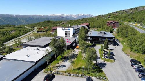 an aerial view of a building with a parking lot at Radisson Blu Resort, Beitostølen in Beitostøl