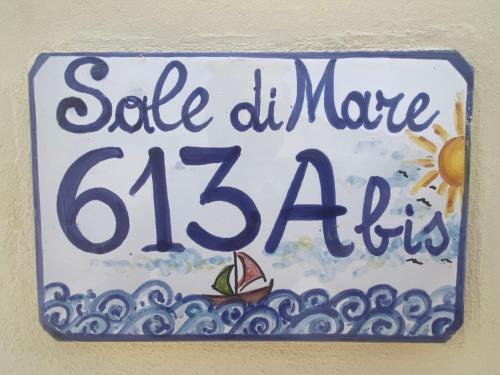 a sign on a wall that reads sale dhmine at Sale di Mare in Marsala