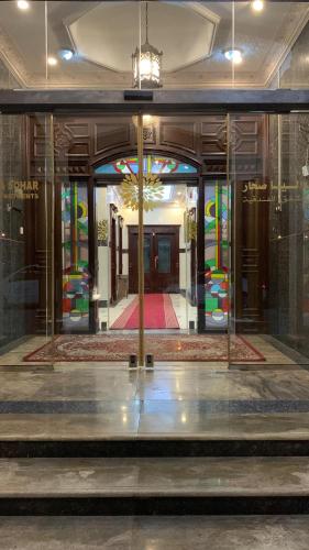 a building with stained glass windows and a lobby at Dahlia Sohar Hotel Apartments in Sohar