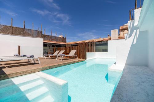 a swimming pool in the backyard of a house at Aristoy in Tarifa