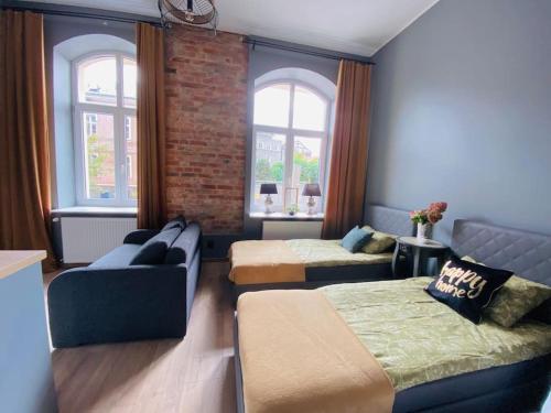 Posteľ alebo postele v izbe v ubytovaní Nowy apartament studio Długa