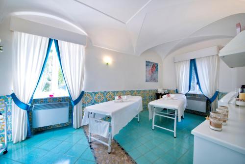 Postel nebo postele na pokoji v ubytování La Reginella Resort & Spa
