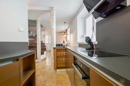 a kitchen with a sink and a counter top at CASA MATTEO in Piran
