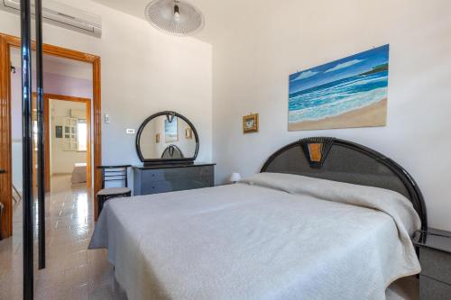 Ένα ή περισσότερα κρεβάτια σε δωμάτιο στο Villetta Stefy by BarbarHouse