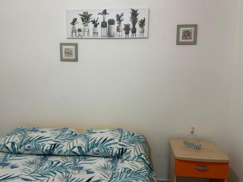 a bedroom with a bed and a nightstand next to a table at Terra Bianca Salento in Nardò