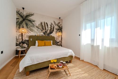 En eller flere senge i et værelse på Villa Hill