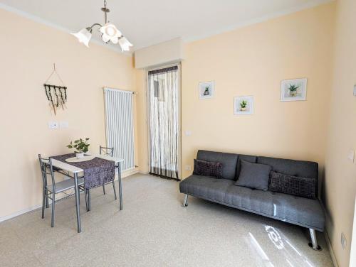 a living room with a couch and a table at Dimora Ianotti in Domodossola