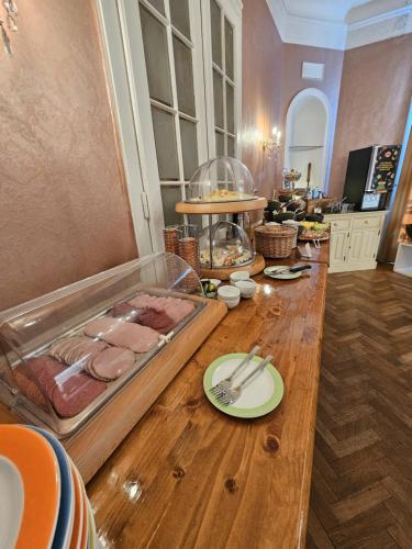 a table with some food on top of it at Hotel Pension Museum in Vienna