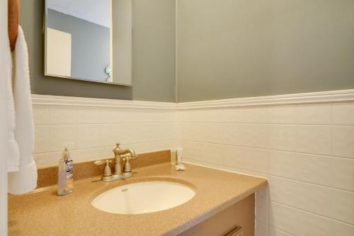 a bathroom with a sink and a mirror at Lakefront Cabin in Dandridge with Fire Pit and Grill! in Dandridge