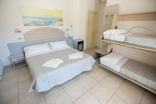 Ένα ή περισσότερα κρεβάτια σε δωμάτιο στο Hotel Petite Fleur