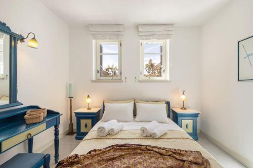 Ένα ή περισσότερα κρεβάτια σε δωμάτιο στο Blue Coral 2